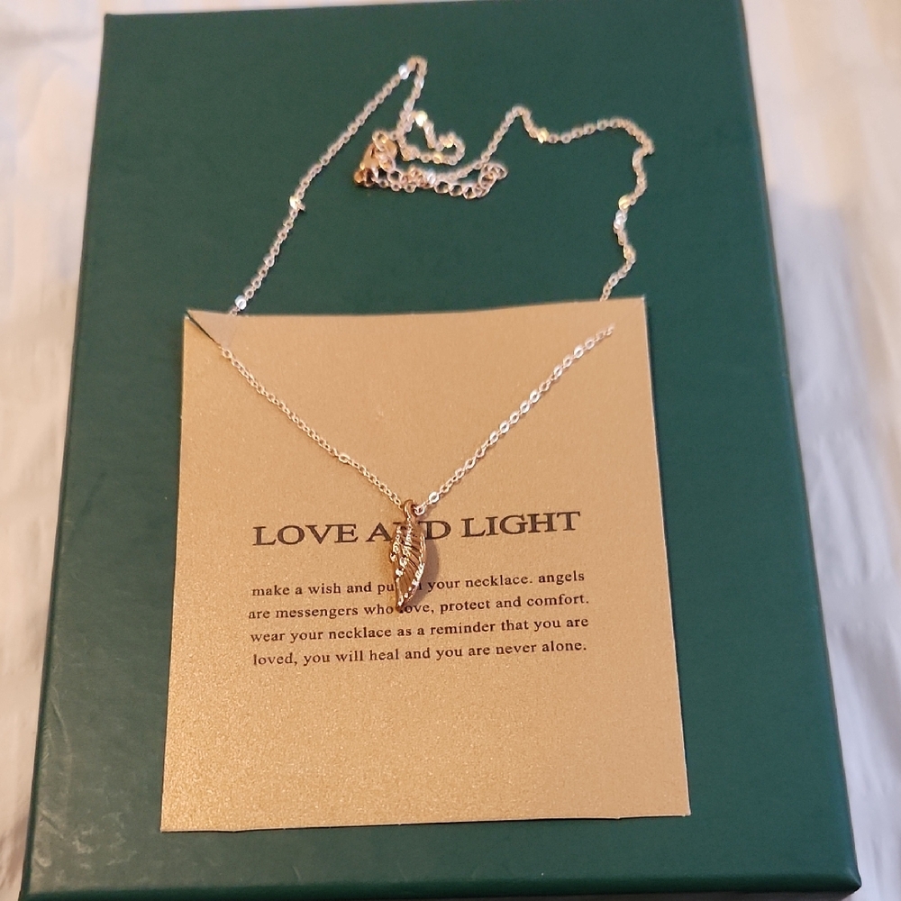 Elegant Silver Feather Pendant Necklace